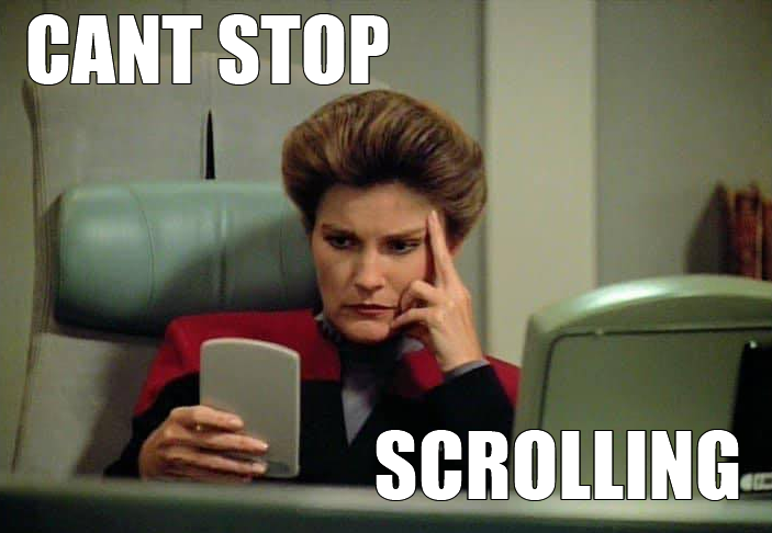 This meme features a still image of Captain Janeway from the TV show Star Trek: Voyager. The image shows her sitting at a console, looking frustrated and annoyed. The text overlay reads "I'm watching paint dry" and "Can't stop scrolling". The meme is a humorous commentary on the tendency to get sucked into online content and lose track of time.